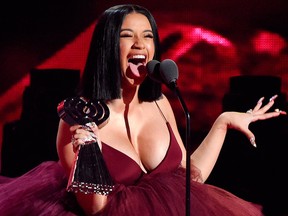 In this March 11, 2018, file photo, Cardi B accepts the Best New Artist award during the 2018 iHeartRadio Music Awards in Inglewood, Calif. (Photo by ) ORG XMIT: NYET300