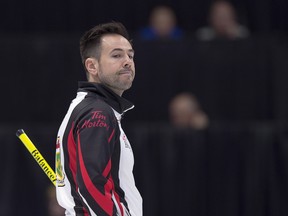 Ontario skip John Epping reacts to a shot as they play Manitoba at the Tim Hortons Brier curling championship at the Brandt Centre in Regina on Tuesday, March 6, 2018. THE CANADIAN PRESS/Andrew Vaughan