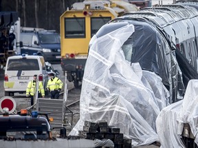 The train involved in the Wednesday morning accident is covered in Nyborg, Denmark, Thursday Jan. 3, 2019. (Mads Claus Rasmussen/Ritzau Scanpix via AP)