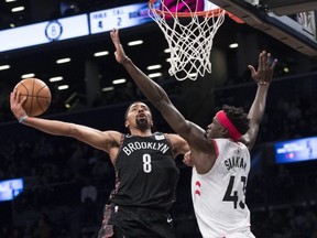 Ever since Nets’ Spencer Dinwiddie (left) led Brooklyn to this Dec. 8 win over Pascal Siakam and the Raptors, the Nets have been one of the NBA’s hottest teams.  AP PHOTO