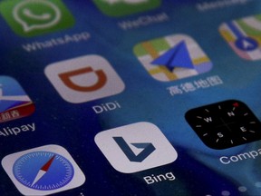 Microsoft Corp.'s Bing appp is seen with other mobile apps on a smartphone in Beijing, Thursday, Jan. 24, 2019. (AP Photo/Andy Wong)