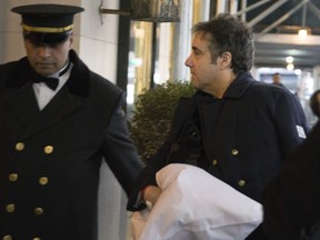 Michael Cohen arrives at his home Thursday, Jan. 18, 2019 in New York.  Democrats are vowing to investigate whether President Donald Trump directed Cohen, his personal attorney, to lie to Congress about a Moscow real estate project, calling that possibility a "concern of the greatest magnitude."  (AP Photo/Kevin Hagen)