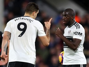 Aboubakar Kamara of Fulham argues with teammate Aleksandar Mitrovic over who will take a  penalty against Huddersfield Town at Craven Cottage on December 29, 2018 in London. (Clive Rose/Getty Images)