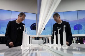Hansjoerg Reick looks at a display of Oral-B Genius X smart toothbrushes at the Procter & Gamble booth before CES International, Monday, Jan. 7, 2019, in Las Vegas.