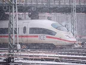 An ICE high speed train leaves the main station in Munich during snowfall on January 4, 2019. (OUTSVEN HOPPE/AFP/Getty Images)