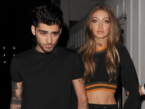 Zayn Malik and Gigi Hadid leave the Versace Versus show in London, England on Sept. 17, 2016.