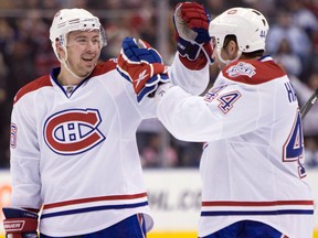 Montreal Canadiens defenceman Josh Gorges, left, celebrates his goal with teammate Roman Hamrlik, of Czech Republic, during third period NHL action against the Toronto Maple Leafs in Toronto on April 4, 2009.