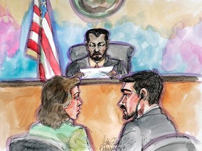 In this April 25, 2006 file artist's sketch, terror probe defendant Hamid Hayat, right, and his attorney Wazhma Mojaddidi, left, listen as U.S. District Judge Garlend E. Burrell Jr. reads the jury's guilty verdict at the federal courthouse in Sacramento, Calif.