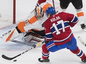 Canadiens' Brett Kulak scores against Philadelphia Flyers goaltender Carter Hart during third period action in Montreal on Saturday, Jan. 19, 2019.