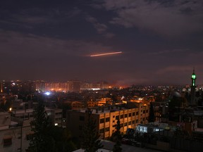 A picture taken early on January 21, 2019 shows Syrian air defence batteries responding to what the Syrian state media said were Israeli missiles targeting Damascus. (Getty Images)