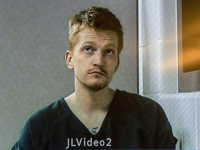 In this Dec. 5, 2018, file photo, Jared Chance appears on a monitor during a video arraignment at the Kent County Courthouse in Grand Rapids, Mich. (Cory Morse/The Grand Rapids Press via AP, File)