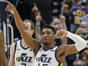 Jazz guard Donovan Mitchell (45) celebrates as he walks up court during second half NBA action against the Timberwolves on Friday, Jan. 25, 2019, in Salt Lake City.
