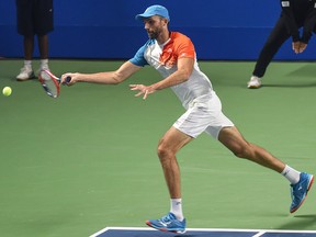 Ivo Karlovic of Croatia hits a return against Steve Darcis of Belgium during the Tata Open Maharashtra ATP tennis tournament at the Shree Shiv Chhatrapati Sports Complex Stadium in Pune on Jan. 4, 2019.