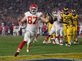 In this Nov. 19, 2018, file photo, Kansas City Chiefs tight end Travis Kelce scores a touchdown against the Los Angeles Rams during the second half of an NFL game, in Los Angeles.