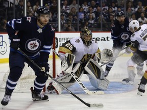 Golden Knights goaltender Marc-Andre Fleury keeps his eyes on the action during the Jets victory in Winnipeg on Tuesday night. (Kevin King/Winnipeg Sun)