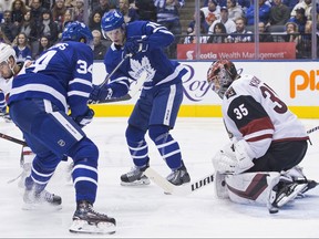 Maple Leafs forwards Auston Matthews (left) and Mitch Marner can't get the puck past Arizona Coyotes goaltender Darcy Kuemper on Sunday night in Toronto. (Chris Young/The Canadian Press)