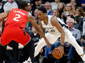 DeMar DeRozan of the San Antonio Spurs is guarded by Kawhi Leonard of the Toronto Raptors before the opening tip-off at AT&T Center on Jan. 3, 2019 in San Antonio, Texas.