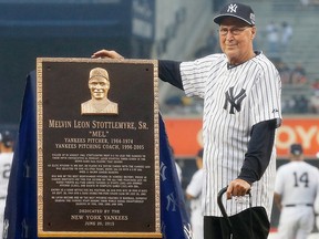Former New York Yankees player and coach Mel Stottlemyre poses with his plaque that will be placed in Monument Park at Yankee Stadium prior to a game against the Detroit Tigers on June 20, 2015. (Jim McIsaac/Getty Images)