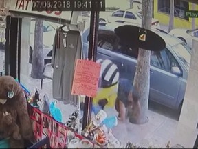 Surveillance video shows a man attacking a partially-blind man wearing a Minion costume. (Daytona Beach News-Journal/YouTube)