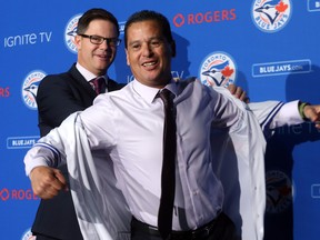 Jays GM Ross Atkins introduces Charlie Montoyo as the team’s manager last October. Aside from Justin Smoak at first base, Montoyo expects his lineup to be fluid. (Dave Abel/Toronto Sun Files)