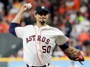In this Wednesday, Oct. 17, 2018 file photo, Houston Astros starting pitcher Charlie Morton throws against the Boston Red Sox during the first inning in Game 4 of a baseball American League Championship Series in Houston.