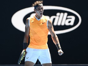 Spain's Rafael Nadal reacts after a point against Australia's James Duckworth during their men's singles match on day one of the Australian Open tennis tournament in Melbourne on Jan. 14, 2019.