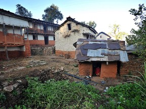 In this file photo taken on November 23, 2011 a Nepali teenage girl sits inside a "chhaupadi house" in Achham village. (PRAKASH MATHEMA/AFP/Getty Images)