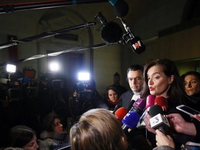 French lawyers Mario Stasi and Sophie Obadia, right, defending a Canadian tourist speak to the press after walking out of the court in Paris, Thursday, Jan. 31, 2019.