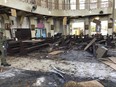 In this photo provided by WESMINCOM Armed Forces of the Philippines, a soldier views the site inside a Roman Catholic cathedral in Jolo, the capital of Sulu province in the southern Philippines after two bombs exploded Sunday, Jan. 27, 2019.