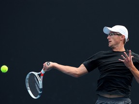 Peter Polansky of Canada plays a forehand in his match against Ernesto Escobedo of the United States during day one of Qualifying for the 2019 Australian Open at Melbourne Park on Jan. 8, 2019 in Melbourne, Australia.