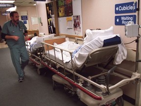 Patients wait in the hallway at the overcrowded Queensway-Carleton Hospital in Ottawa in 2016.