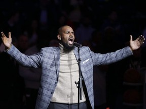 In this Nov. 17, 2015, file photo, singer R. Kelly performs the national anthem before an NBA game between the Brooklyn Nets and the Atlanta Hawks in New York.