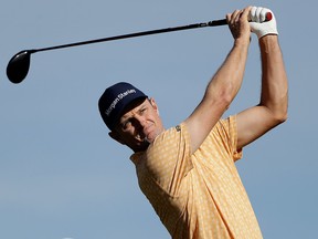 Justin Rose, of England, watches his tee shot on the second hole of the South Course at Torrey Pines Golf Course during the final round of the Farmers Insurance golf tournament Sunday, Jan. 27, 2019, in San Diego.