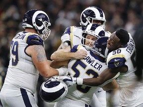 Johnny Hekker and Greg Zuerlein of the Los Angeles Rams celebrate after kicking the game winning field goal in overtime against the New Orleans Saints in the NFC Championship game at the Mercedes-Benz Superdome on January 20, 2019 in New Orleans. (Kevin C. Cox/Getty Images)