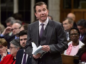 Treasury Board President Scott Brison stands during question period in the House of Commons on Parliament Hill in Ottawa on March 27, 2018.