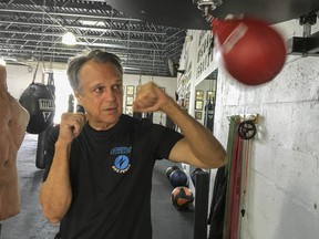 Steve Shepherd, a world champion kickboxer, works out Thursday, Jan. 3, 2019, in West Palm Beach, Fla. Shepherd was limping to his car last week, a pulled muscle impairing his stride, when a mugger hit him in the head with a bottle and demanded his cellphone. Shepherd threw a right cross to the attacker's head, and then smashed a hook to his ribs, crumpling him. Bystanders interceded and the man escaped. Shepherd suffered a ruptured eardrum, a cut and bruise.