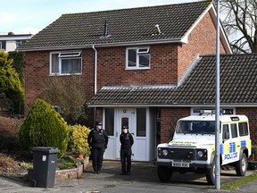 In this file photo taken on March 6, 2018, British Police Community Support Officers stand on duty outside the home of former Russian double agent Sergei Skripal. (CHRIS J RATCLIFFE/AFP/Getty Images)
