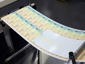 Blank U.S. Treasury checks are run through a printer at the printing facility July 18, 2011 in Philadelphia. (William Thomas Cain/Getty Images)