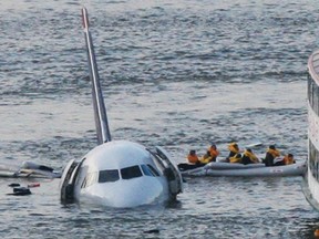 FILE - In this Jan. 15, 2009 file photo, passengers in an inflatable raft move away from an Airbus 320 US Airways aircraft that has gone down in the Hudson River in New York. Accident investigators say they object to their portrayal in a new movie based on the ìMiracle on the Hudsonî river ditching of airliner seven years ago after striking geese. (AP Photo/Bebeto Matthews, File) ORG XMIT: WX201 0922 ar jane on a plane