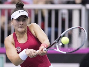 Bianca Andreescu of Canada returns to Lesia Tsurenko of Ukraine during their Fed Cup tennis match in Montreal, Saturday, April 21, 2018.