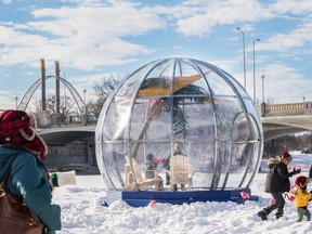 Skaters enjoy the skating trail and warming huts along rivers near downtown Winnipeg. The Forks, a patch of downtown land at the junction of the Red and Assiniboine rivers is a beehive of activity in winter for city residents who embrace outdoor activities in the cold.