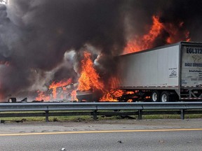 Flames engulf vehicles after a fiery crash along Interstate 75, Thursday, Jan. 3, 2019, about a mile south of Alachua, near Gainesville, Fla. (WGFL-Gainesville via AP)
