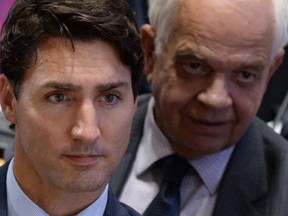 Immigration, Refugees and Citizenship John McCallum sits with Prime Minister Justin Trudeau as he co-hosts the Leaders’ Summit on Refugees at the United Nations headquarters in New York on Tuesday, Sept. 20, 2016. THE CANADIAN PRESS/Sean Kilpatrick ORG XMIT: SKP117