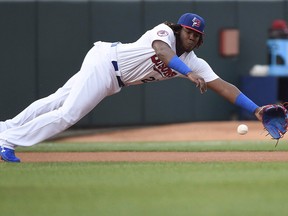 Buffalo Bisons third baseman Vladimir Guerrero Jr. (27) dives for the ball during triple-A action in Buffalo on Tuesday, July 31, 2018. (THE CANADIAN PRESS/Nathan Denette)