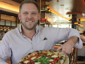 Executive Chef Brian Bornemann serves up crispy wood-fired oven pizza at Viale dei Romani in west Hollywood.