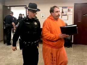 A law enforcement officer leads William Shrubsall through the Niagara County Court House in Lockport, N.Y. on Tuesday, Jan. 22, 2019.