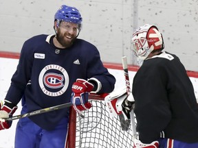 Canadiens captain Shea Weber has a laugh with goalie Carey Price during practice at the Bell Sports Complex in Brossard on Thursday Jan. 31, 2019.