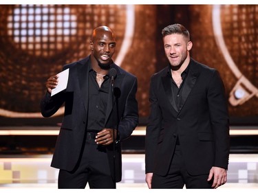 LOS ANGELES, CA - FEBRUARY 10:  Devin McCourty (L) and Julian Edelman speak onstage during the 61st Annual GRAMMY Awards at Staples Center on February 10, 2019 in Los Angeles, California.