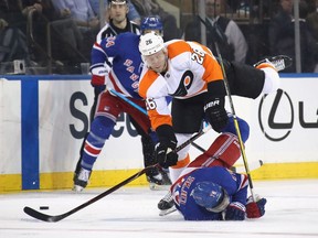 Defenceman Christian Folin of the Philadelphia Flyers hits Brady Skjei of the New York Rangers at Madison Square Garden in New York on Jan. 29, 2019.