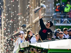 Tom Brady of the New England Patriots reacts as he holds the Vince Lombardi trophy during the Super Bowl Victory Parade on Feb. 05, 2019 in Boston. (Billie Weiss/Getty Images)